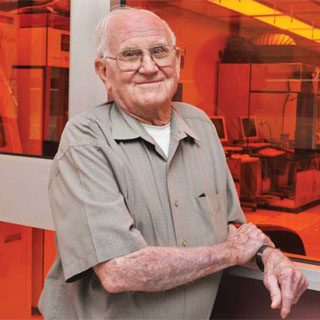 Cleanroom inventor Willis Whitfield, who passed away this week at age 92, lived long enough to see his creation mark its 50th anniversary. Willis, who retired from Sandia in 1984, pauses here during a tour of a cleanroom in Sandia’s microsystems fabrication facility. (Photo by Randy Montoya)