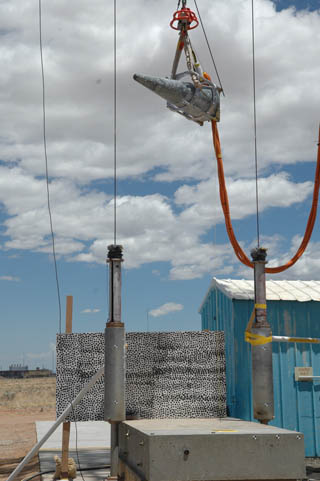 DROP TEST Ñ Sandia performed a drop test for the W88 ALT 370 program, designed to replicate a crane dropping the reentry body onto a concrete surface. The test was conducted at the LabsÕ 185-foot Drop Tower Facility, using the same handling gear a crane would use to move the weapon.	(Photo by Mark Nissen, 1535)