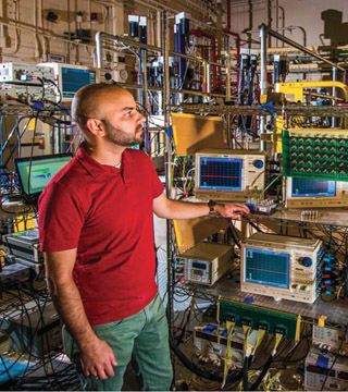 WORKING WITH QASPR — Billy Martin (6221) looks over diagnostics as part of Sandia’s QASPR program, developed as a way to ensure the nation’s stockpile is safe, secure, and effective after the closure of the Sandia Pulsed Reactor. For more about the QASPR program, see page 4. (Photo by Randy Montoya)