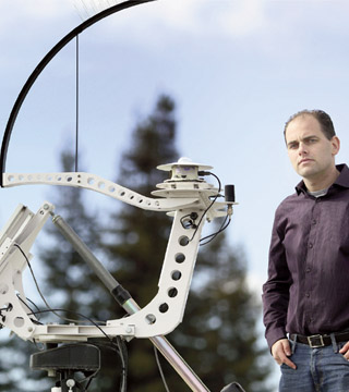Matt Lave (6112) uses pyranometers like these to measure the amount of irradiance, or available sunlight. There are four round pyranometers, capped by small glass domes, on this device. The work by Matt and Josh Stein (6112) shows that the variability of a point sensor is larger than the variability of a PV power plant. (Photo by Dino Vournas)