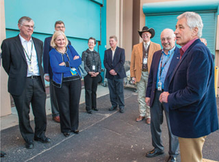 Z FACILITY TOUR — Secretary of Defense Chuck Hagel, right, pauses outside Sandia’s Z Pulsed Power Facility during a Jan. 8 tour. With Hagel are, left to right, Donald Cook, deputy administrator for Defense Programs at NNSA; Madelyn Creedon, assistant secretary for Global Strategic Affairs; VP and Chief Technology Officer Julia Phillips; VP of Science and Technology Div. 1000 Duane Dimos; Geoffrey Beausoleil, manager of the NNSA Sandia Field Office, and Sandia President and Labs director Paul Hommert. (Photo by Randy Montoya)