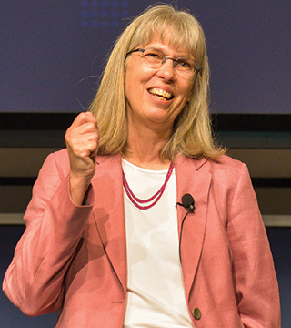 Jill Hruby, who this week was announced as Paul Hommert’s successor as Sandia president and Laboratories director, greets Sandians during her first Labs-wide all-hands meeting. She officially assumes her new role on July 17. (Photo by Randy Montoya)