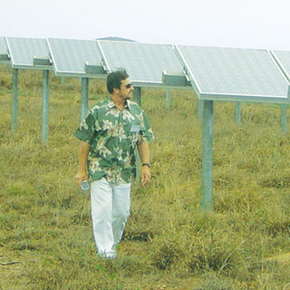 WARD BOWER (6364) is part of a Sandia team that is studying the effects of cloud cover on large photovoltaic installations on the island of LanaÕi in the Hawaiian Islands. Here, he checks out a field of PV collectors on the sparsely populated 141-square-mile island.