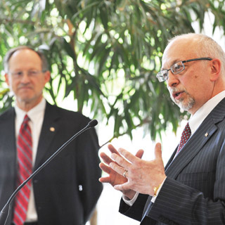 OUR NEW LEADER  Paul Hommert, right, answers questions from the media during a news conference on May 13 announcing Tom Hunters retirement as Sandia president and Labs director and Paul Hommerts appointment to the position. Tom, at left, said the past five years mark an era of the Labs history that employees can be extremely proud of.	(Photo by Randy Montoya)