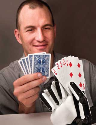 Image of <p>Principal investigator Curt Salisbury (6533) developed an affordable robotic hand that is dexterous enough to mimic the capabilities of a human hand. (Photo by Randy Montoya)</p>