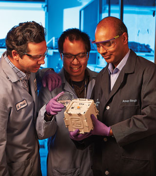 Matt Piccini (8621), left, Chung-Yan Koh (8621) and Anup Singh (8620) lead the SpinDx team. SpinDX is a diagnostic tool with medical and non-medical applications. (Photo by Jeff McMillan)