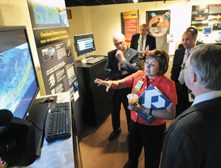 Image of <p><span face="Cambria"><span size="3"><strong>THE GOVERNOR TOURS</strong> — New Mexico Gov. Susana Martinez, accompanied by Sandia President and Laboratories Director Paul Hommert, left, and others, visits the Cooperative Monitoring Center to get a first-hand look at Sandia-developed national security technologies.</span></span></p>