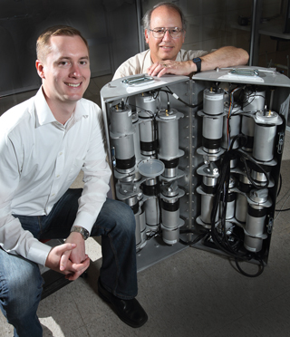 At an emergency response exercise in downtown Chicago, Mark Gerling, left, and John Goldsmith (both 8127) demonstrated the effectiveness of the mobile imager of neutrons for emergency responders (MINER) system at localizing a radiation source in an urban environment. (Photo by Dino Vournas)