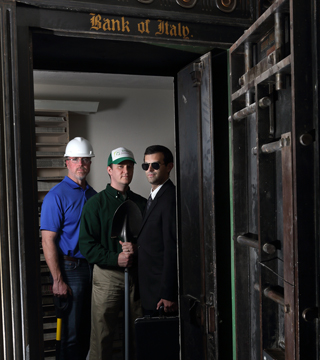 SANDIA RESEARCHERS Alex Roesler, left, Luke Purvis, and Jarret Lafleur, shown here inside a Bank of Italy vault in a historic Livermore building, studied 23 high-value heists that occurred in the last three decades for lessons learned that can be applied to designing complex security systems to protect vital national security assets.	(Photo by Dino Vournas)