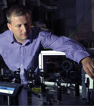 Sandia optical diagnostics researcher Christopher Kliewer has won a DOE Early Career Research award that will fund the development of new optical diagnostic tools to study interfacial combustion interactions, which are major sources of pollution and vehicle inefficiency.	(Photo by Dino Vournas)