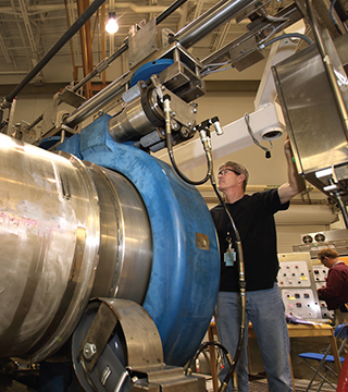 Tom Raber (8137) prepares the EXPLOSIVES DESTRUCTION SYSTEM (EDS) explosive containment vessel for shipment to the US Army Pueblo Chemical Depot. Over the next five years, two EDS units are expected to process more than 1,000 chemical munitions as part of a larger cleanup operation at the Pueblo, Colorado, facility.	(Photo by Dino Vournas)