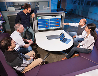 When UQ met LES — Mohammad Khalil, Joseph Oefelein, Guilhem Lacaze, Layal Hakim, and Habib Najm (all 8351), researchers at Sandia’s Combustion Research Facility, are applying Uncertainty Quantification (UQ) principles to Large Eddy Simulations (LES) to create simpler combustion models. Here the team discusses results for a project on statistical calibration of simplified chemical mechanisms for diesel engine combustion. (Photo by Randy Wong)
