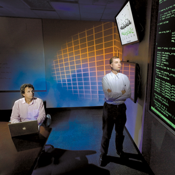 Its complex Rob Armstrong (8961), left, and Jackson Mayo (8963) lead a Laboratory Directed Research and Development study to apply complex-system theory to cyber security. (Photo by Randy Wong)