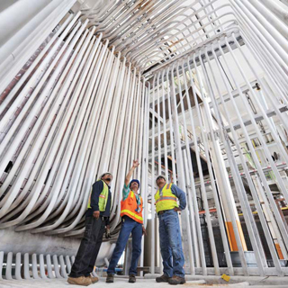 FINAL INSPECTION Ñ Bldg. 605 demolition team membersVincent Toya, left, Michael Pacheco, and Loren Sanchez inside thepipe framework of one of four boilers at SandiaÕs 60-year-oldsteam plant. The water flowing through the pipes here washeated by the boiler and converted to steam, which was thenpiped to facilities all across the Labs. The central steam plant hasbeen replaced over the past several years with a system based ondistributed boilers. (Photo by Randy Montoya)