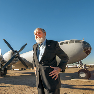 But for the toss of a coin, Sandia pioneer Leon Smith would have served as the weaponeer on the Enola Gay on its fateful mission to drop the bomb on Hiroshima that precipitated the end of World War II. Leon, seen here in front of a B-29 at the National Museum of Nuclear Science and History, died in mid-October at the age of 92. (Photo by Randy Montoya)