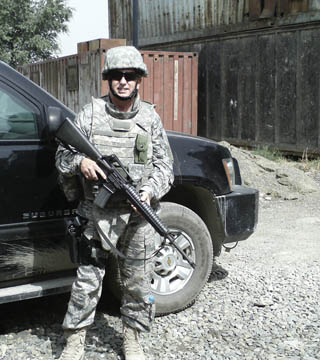 Image of <p>DEPLOYED TO AFGHANISTAN — Sandia’s Andy Anderson (6815) poses outside the Afghan Army Logistics Headquarters in Kabul in 2011 during his deployment as a colonel in the Air Force Reserves. Andy, who recently retired from the Reserves, and Sandia have been named the Air Force Reserve 2013 Citizen Airman and Employer of the Year. (Photo courtesy of Andy Anderson)</p>