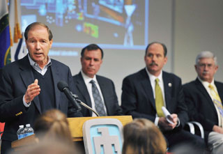 Image of <p>THE TRUTH AS I SEE IT — Sen. Tom Udall presents his views on the challenges facing the US in cyberspace, and what Sandians and CERL can do to help secure that useful but increasingly threatened arena. To the right of the senator are NNSA official Dimitri Kusnezov, Albuquerque Mayor Richard Berry, and UNM Research VP McGraw.</p>