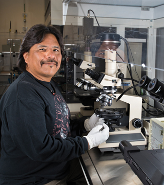 Nelson Capitan (2712-2) started his Sandia career in environmental restoration and moved to the active ceramic trades in Neutron Tube Manufacturing. “I like the lab work,” he says.	(Photo by Randy Montoya)