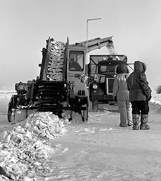 CREWS CLEAN UP DEBRIS from the crash of a B-52 near Thule, Greenland, in 1968.