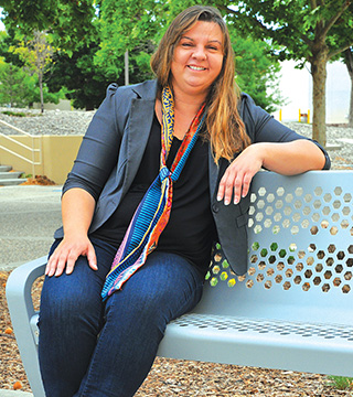 GIVING BACK — Computer scientist Sandra Faust, a mother of two, reaches out to Albuquerque young people through a weekly math club. “Getting the younger generation involved in STEM, in particular girls, minorities, and the disadvantaged, is very important to me,” she says. “As a professional, I offer another point of view without the grades, tests, and other pressures. I am free to expose children to aspects of math not covered in the classroom, like hands-on activities and games.”