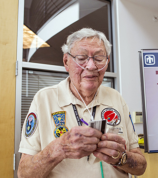 ONE LAST LOOK — As Harold Rarrick prepares to turn in his clearance badge after 65 years, he reflects on two lifetimes’ worth of service to Sandia and the nation. Although Harold, who started at Sandia in October 1949, retired from the Labs in 1993, he remained involved with Sandia as a consultant and senior mentor in the Weapon Intern Program until last October. (Photo by Randy Montoya)