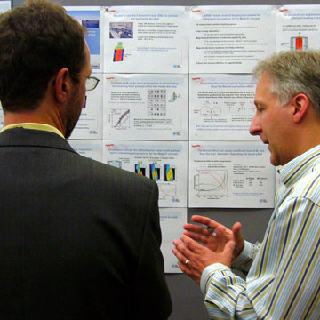 Roger Vesey (1684, right) explains to Ogden Jones of Lawrence Livermore National Laboratory the progress made on integrated target designs for pulsed power-driven liners containing magnetized and preheated fuel.
