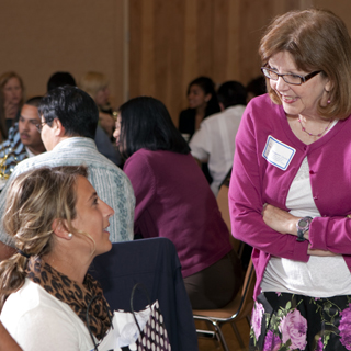 MARGARET QUINN (8522) speaks with one of the recipientsof the award for Outstanding Achievement in Math. (Photo by Randy Wong)