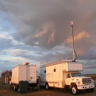 SANDIAS MOBILE GREENHOUSE GAS test facility, which consists of two moving van-sized trucks, each equipped with instrumentation and equipment, measures air quality during a test deployment at DOEs Atmospheric Radiation Measurement facility in Oklahoma. (Photo by Hope Michelsen)