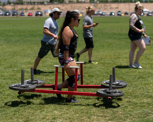 FARMER’S CARRY — Tiffany carried 145 pounds in each hand 155 feet in 60 seconds.