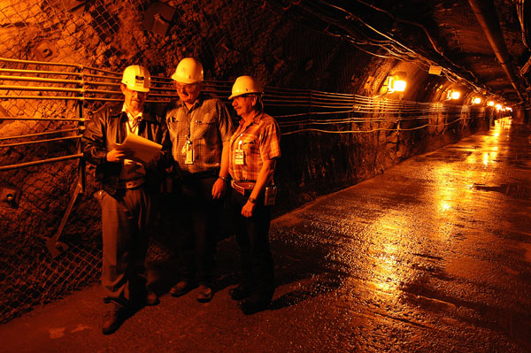 UNDERGROUND TESTING — Sandians Dan Bozman, Mike Burke and Jerry Chael, now retired, work nearly a thousand feet below ground at the Nevada National Security Site underground test complex, formerly the Nevada Test Site. (Photo from Lab News archives)