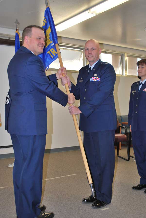 CHANGE OF COMMAND — Brian Carter, right, was named commander of the 433rd Training Squadron during a ceremony in 2012. It was his last tour in the military. (Photo by Edward Rivera, U.S. Air Force)