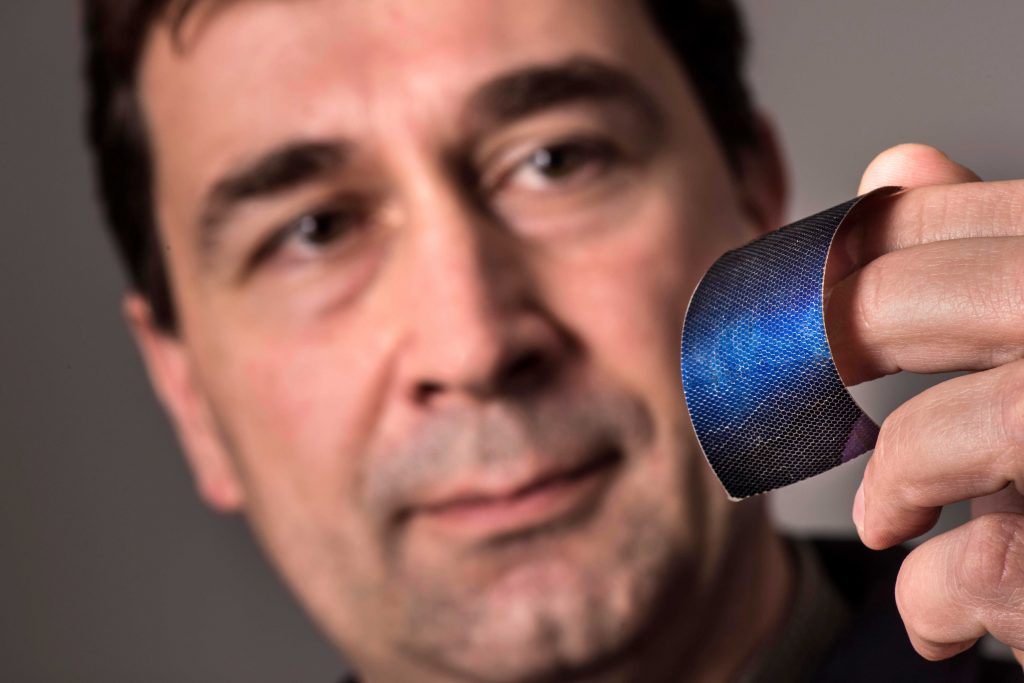 Image of Scientist shows small, lightweight solar cell technology