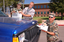 National Guard members viewing vehicle