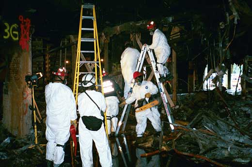 INTEGRATED TEAM — Members of New Mexico Task Force-1 team work together to safely shore up portions of the Pentagon while sifting through and removing debris. (Photos courtesy of Jim Breen)