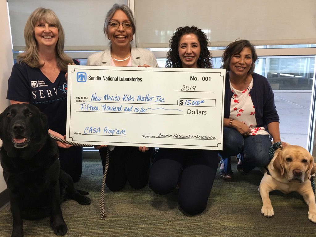THE BIG CHECK — In addition to support from United Way of Central New Mexico, the New Mexico Kids Matter CASA program is a longtime recipient of support from Sandia’s corporate contributions grant program. (Photo courtesy of NM Kids Matter)