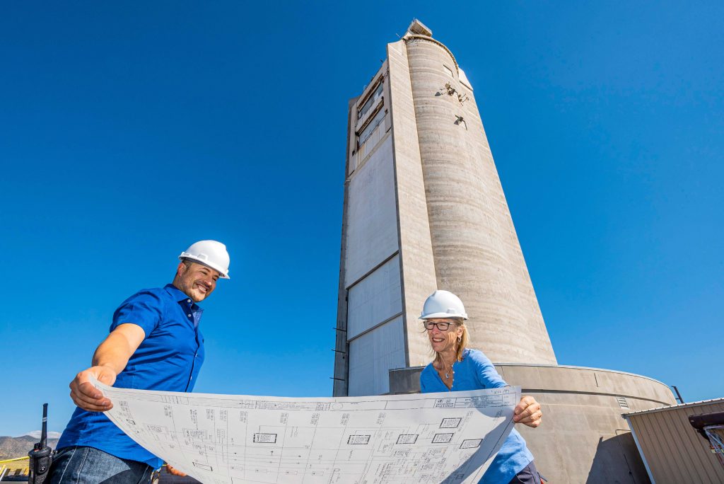 Image of Scientists study blueprint outside Solar Tower