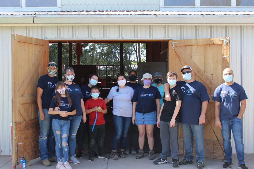 HELPING HANDS — A group of Sandians from the Abilities Champions of New Mexico and Community Involvement spent the day at Mandy’s Farm.