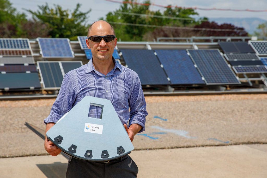 ROCKING INNOVATION — Rocking Solar CEO Darin Palmer holds the rocking mechanism for his patent-pending single-axis tracking design.