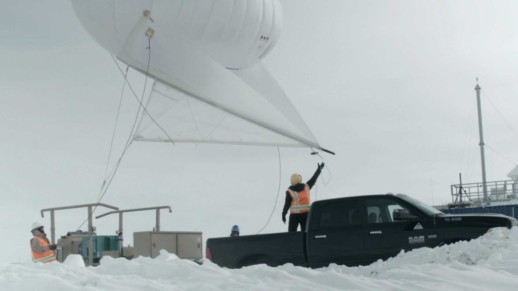 LOOKING AT CLOUDS — Dari Dexheimer and her team prepare to launch a 13-foot-tall tethered balloon, also known as a helikite, from Atmospheric Radiation Measurement’s Oliktok facility. (Photos by Brent Peterson)