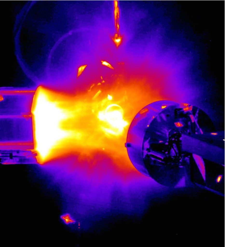 Image of High-energy lasers strike the inside walls of a hohlraum target