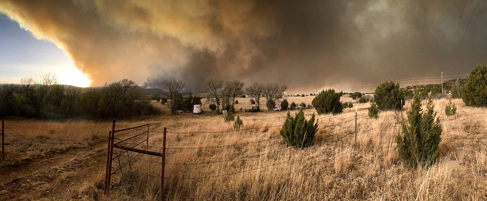 Image of Smoke rises from New Mexico wildfires