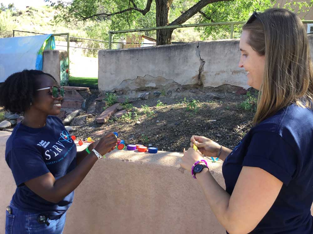 Image of Sandians Leslie Munyao and Monica Barry volunteer at STEM Day with Girls Inc