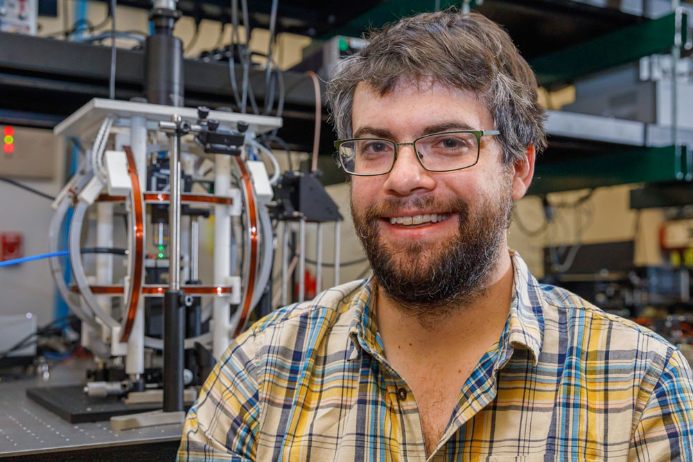 WORK SMALLER — Andy Mounce makes microscopic sensors to try to understand quantum materials at Sandia’s Center for Integrated Nanotechnologies. He is one of four Sandians to earn DOE’s Early Career Research Award. (Photo by Bret Latter)
