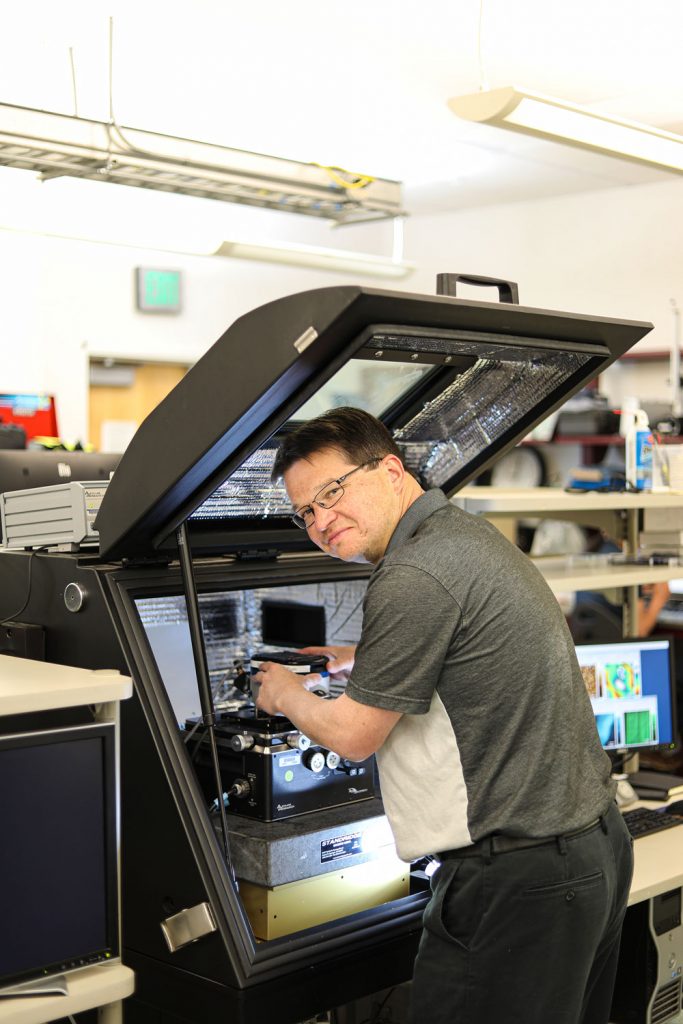 SCIENCE FRICTION — Sandia mechanical engineer Frank DelRio works on an atomic-force microscope to characterize the growth kinetics of amorphous carbon tribofilms on platinum-gold nanocrystalline alloys. (Photo by Lonnie Anderson)
