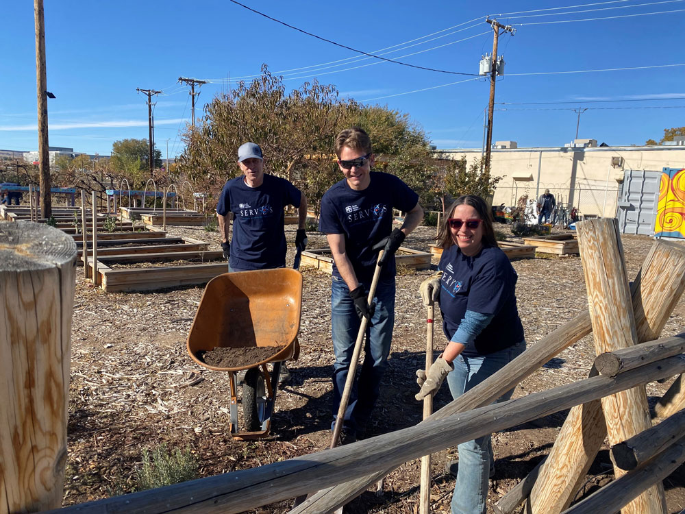 Image of Directors Bryan Oliver, Josh Parsons and Jennifer Gauduoso volunteer during Sandia's Fall Leadership Forum