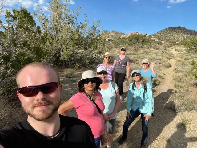 BETTER TOGETHER — Members of new employee resource group Living Alone and Thriving meet up with Sandia’s hiking club in the Sandia foothills. (Photo by Janice Duis)