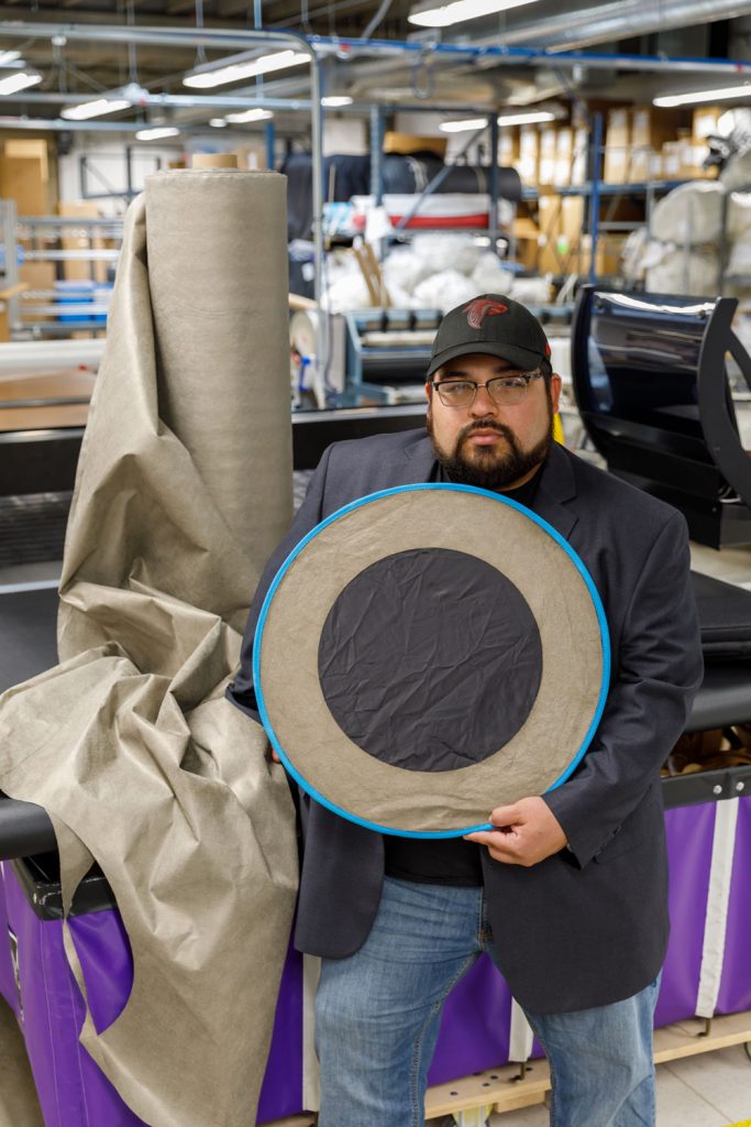 STRONGER SIGNAL — Optical Radio Communications Technology Chief Technology Officer Joshua Benavidez holds a passive signal booster that consists of a conductive material woven into fabric. Sandia enabled ORC Tech to achieve product-development milestones much faster than anticipated. (Photo by Bret Latter)