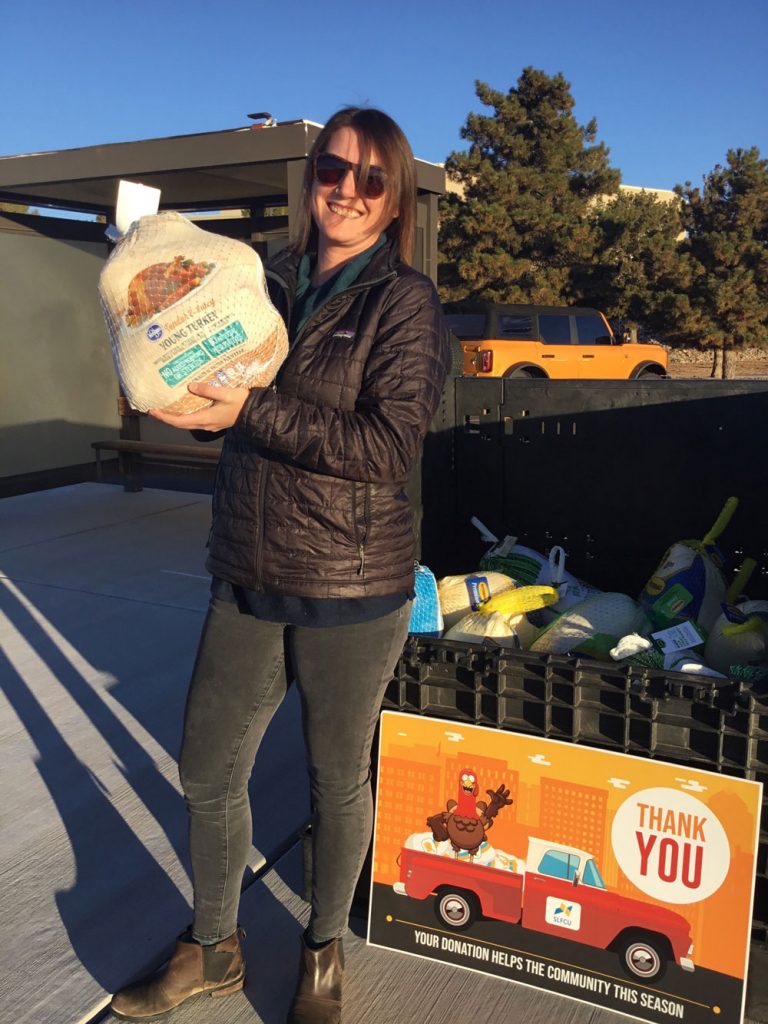 TURKEY DROP — Geosciences engineer Lauren Wheeler drops off a frozen turkey at the Labs on Tuesday. (Photo by Katrina Wagner)