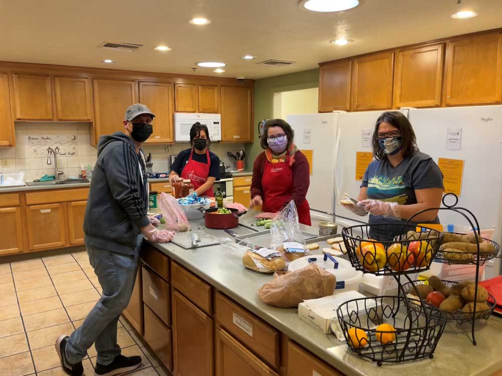 Image of Sandia volunteers prepare a meal at the Ronald McDonald House in Albuquerque