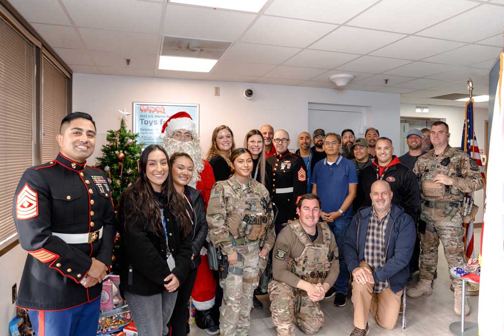 GENEROUS CREW — Sandia Safeguards and Security, Emergency Management, and Shipping and Receiving teams partnered with the U.S. Marines for the annual Toys for Tots campaign in Livermore. (Photo by Spencer Toy)